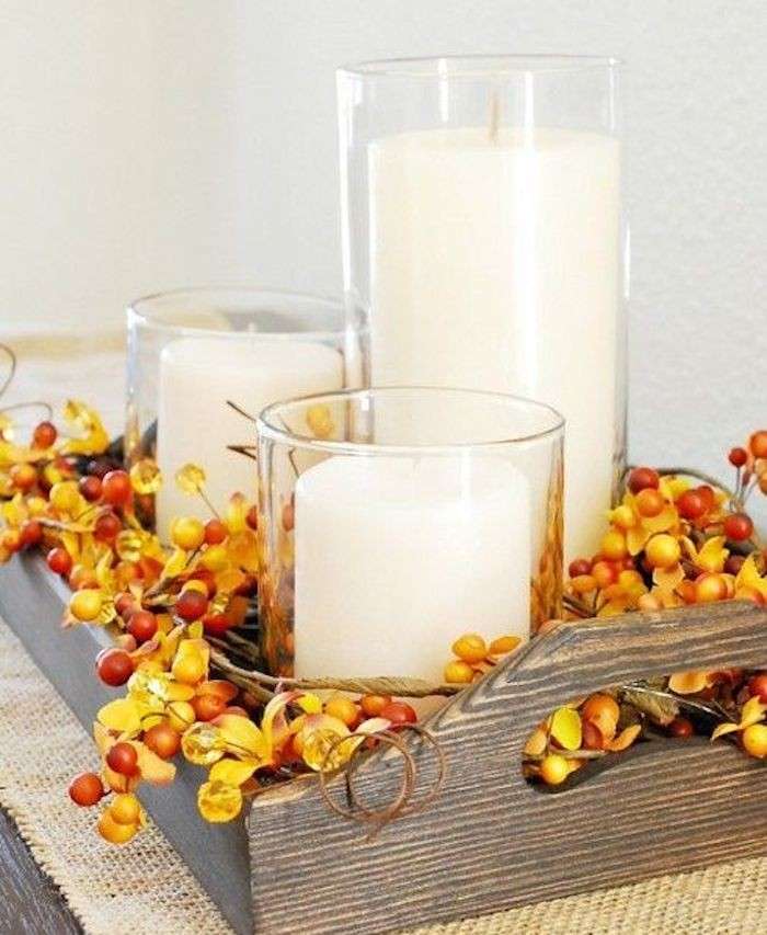 Candele decorate con bacche