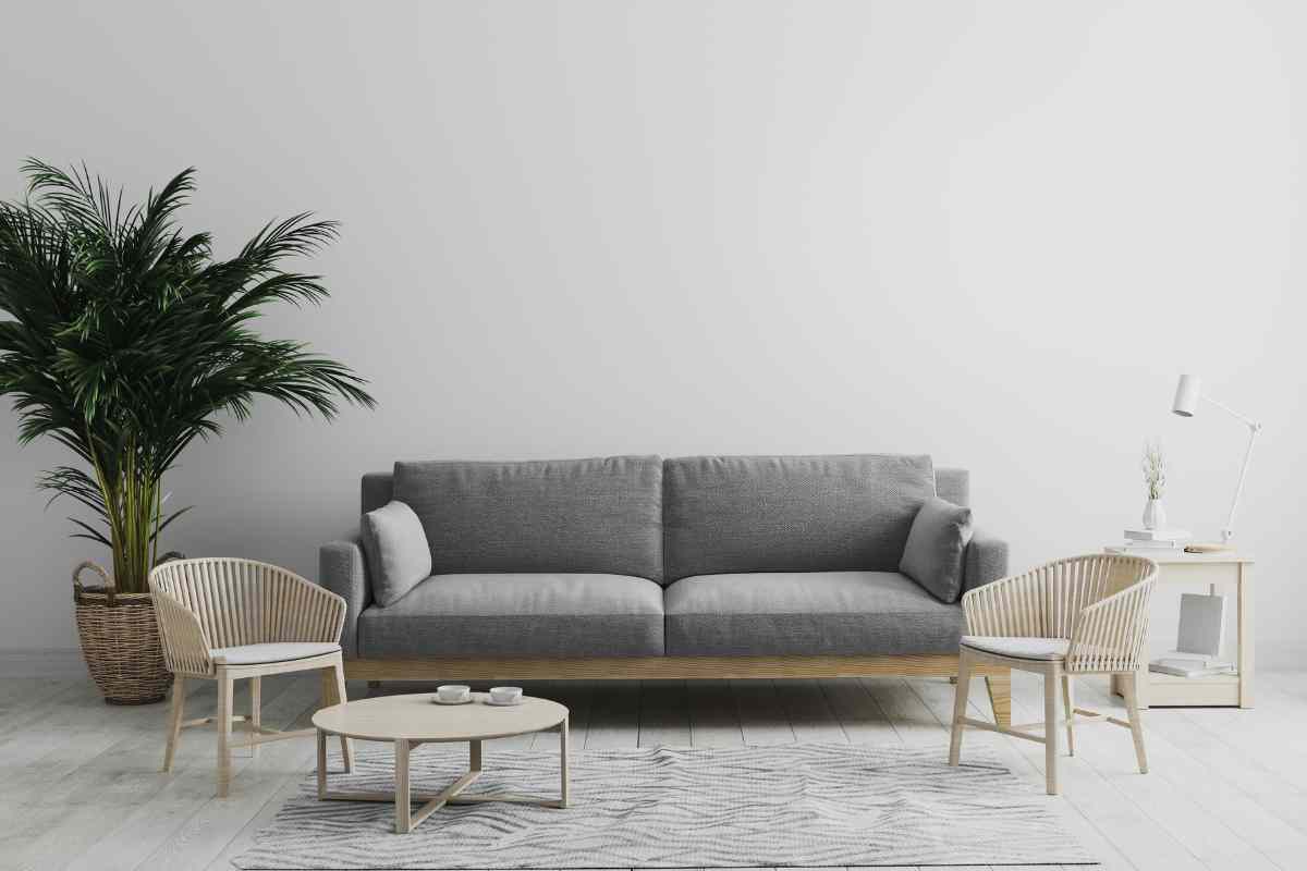 soggiorno moderno con divano grigio e arredi in legno chiaro