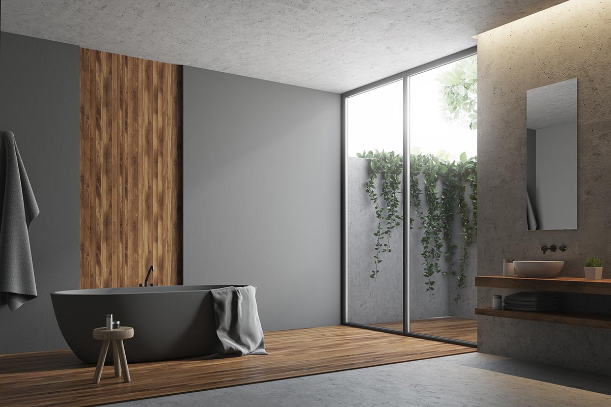 Bagno moderno decorato con tonalità del grigio e inserti in legno