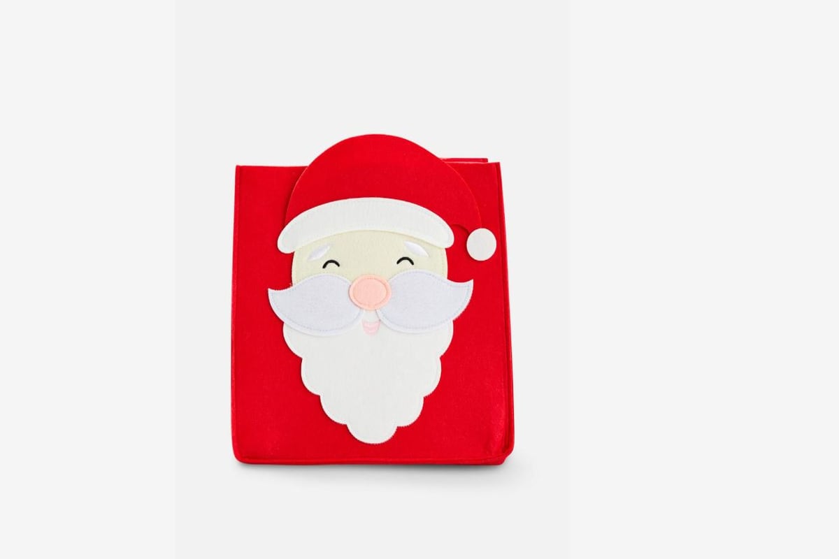 cubo portaoggetti con babbo natale disegnato di colore rosso e bianco