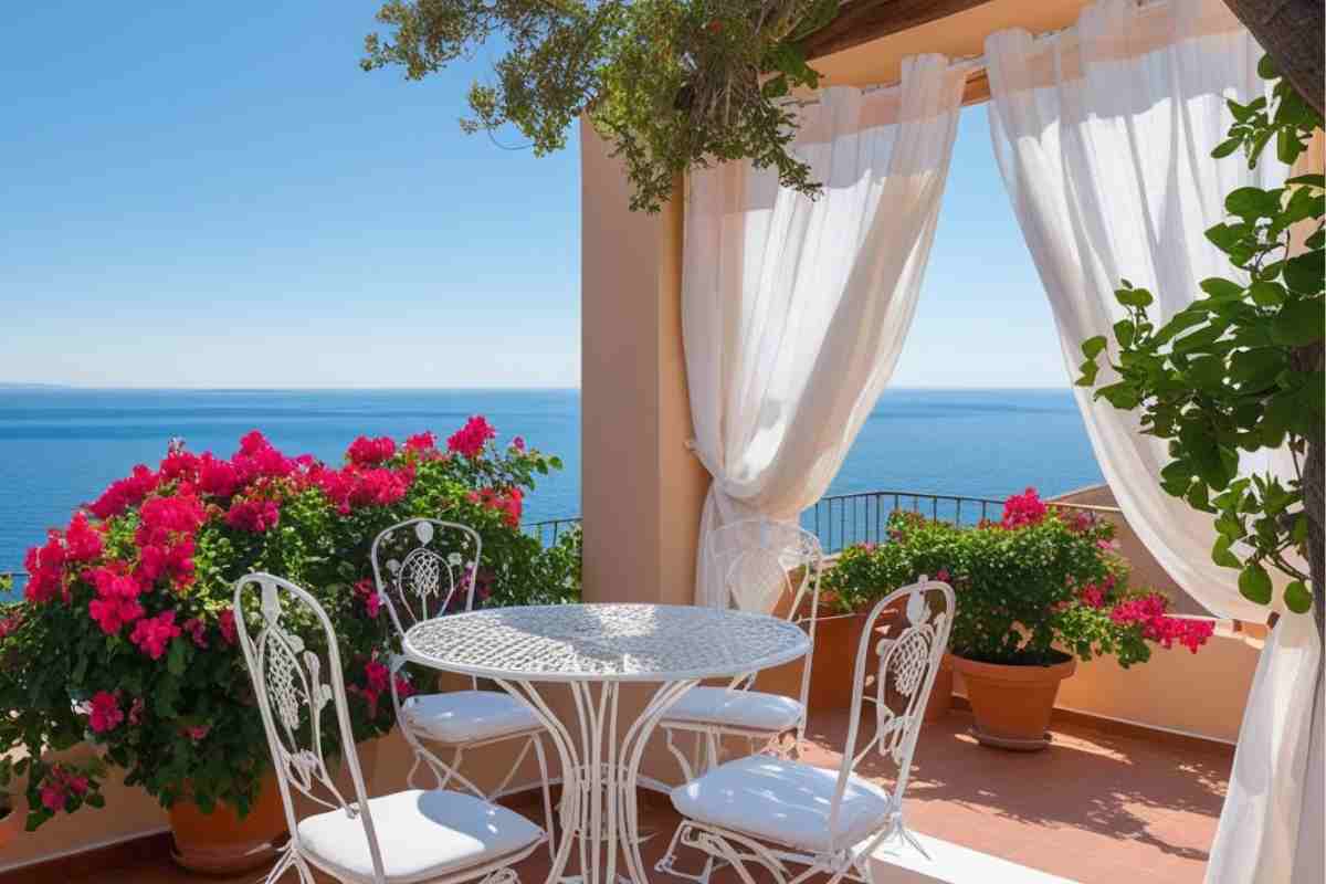 terrazzo sul mare con tavolino in ferro battuto bianco