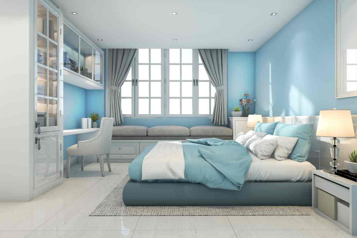 camera da letto moderna con pareti e tessili azzurri