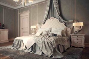 Camera da letto classica con letto con testiera imbottita sovrastata da tende
