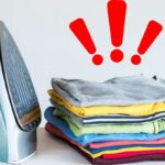 Ferro da stiro, panni e simbolo attenzione