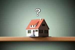 Casa in miniatura e punto di domanda