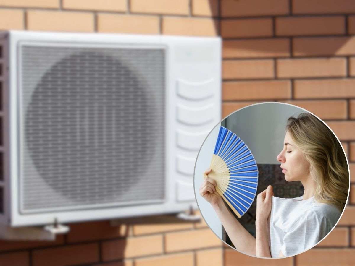 Condizionatore donna che si sventola connventaglio per caldo