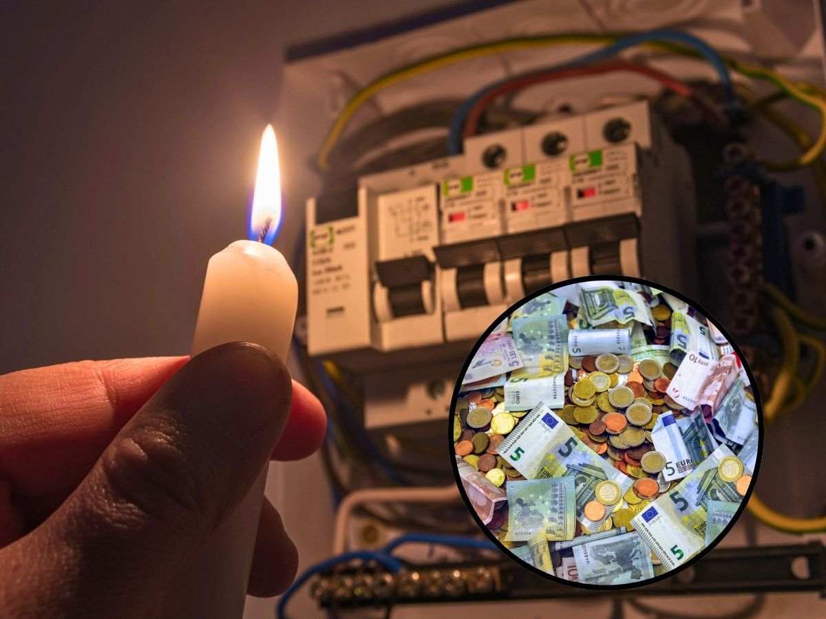 sfondo contatore al buio con mano con candela accesa e tondo con banconote e monete euro