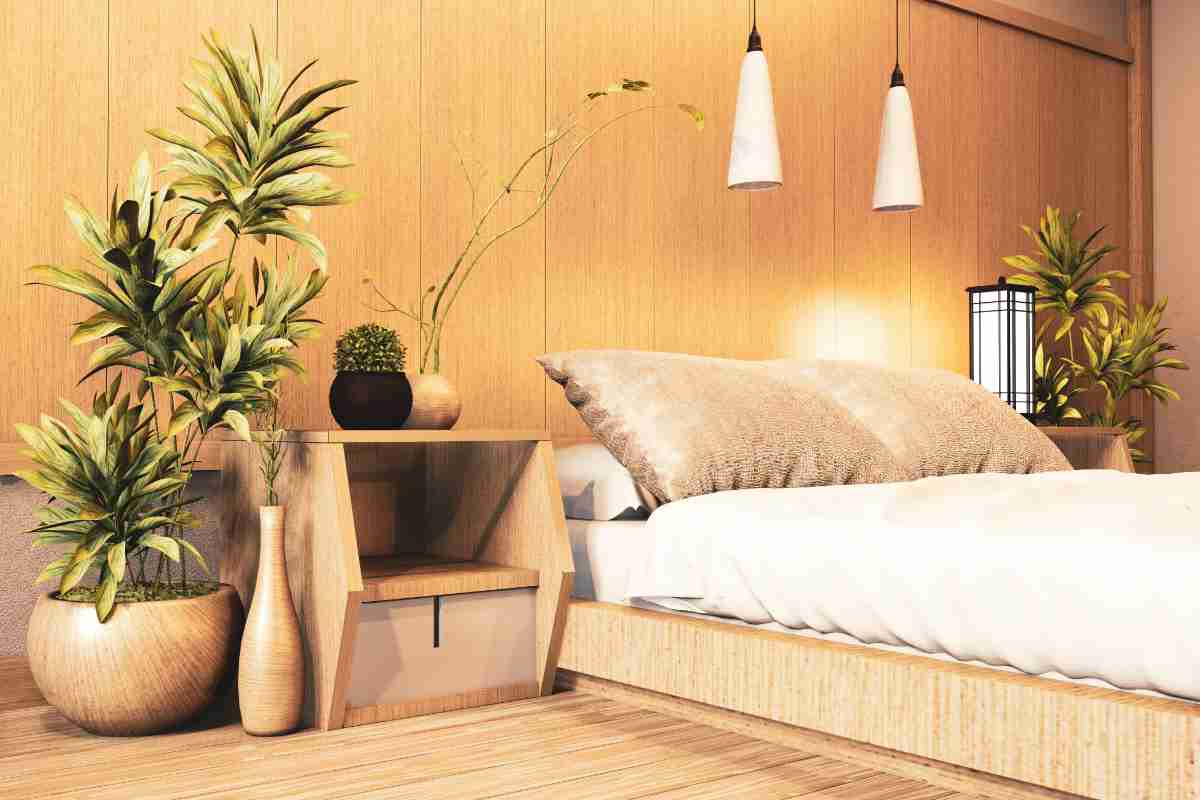 Camera da letto stile japandi con piante