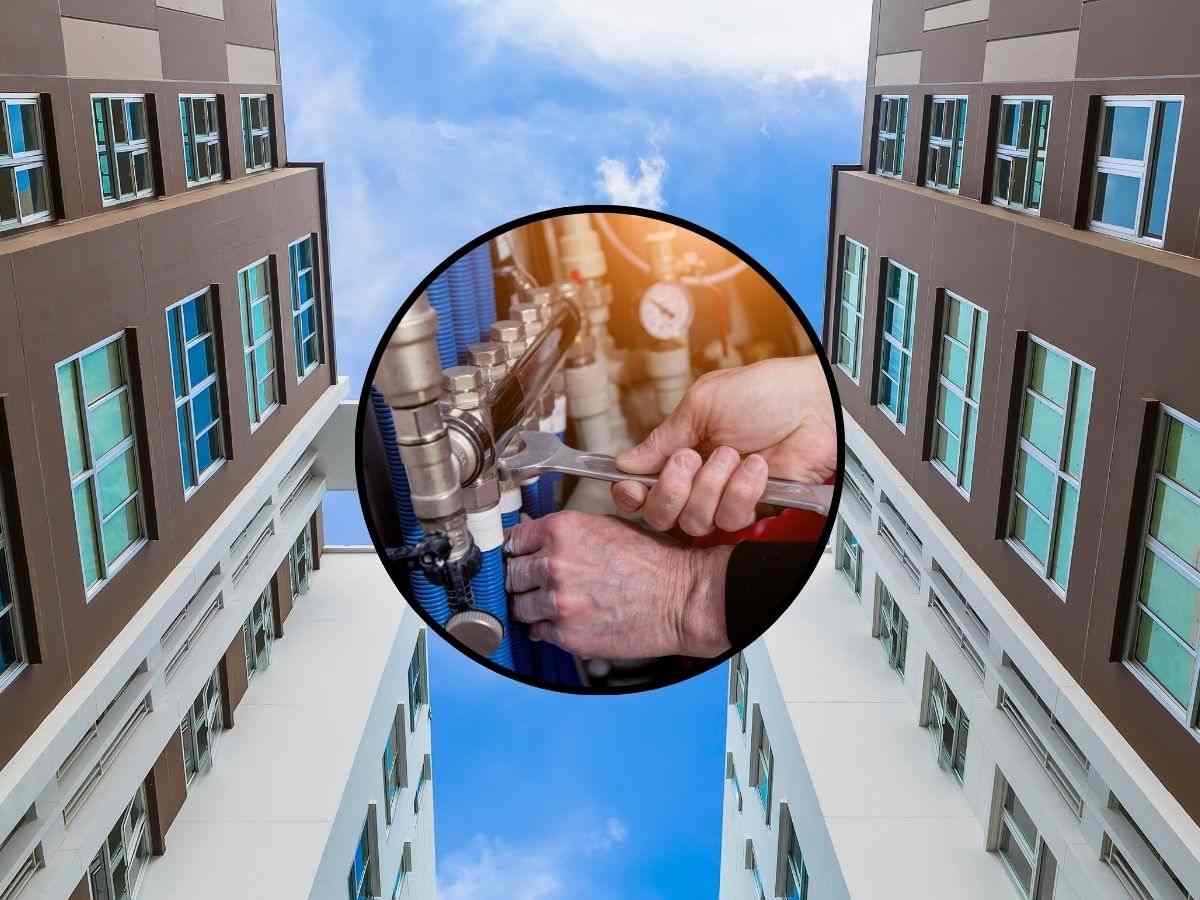sfondo condominio e tondo con mano e chiave inglese