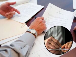 sfondo con documenti e tondo con mano che firma
