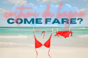 Costumi da bagno stesi con mare di sfondo