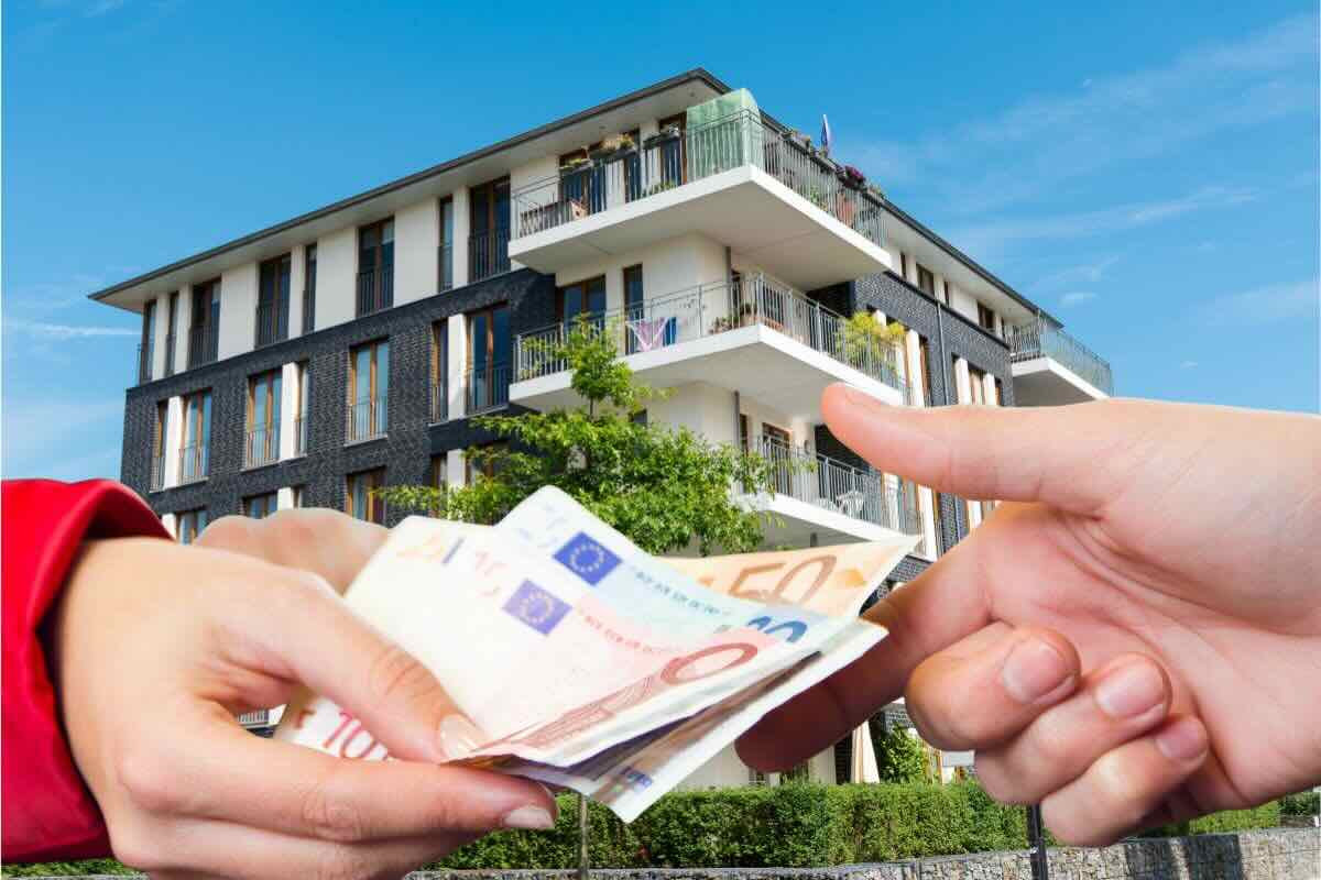 Edificio sul fondo, due mani si passano soldi