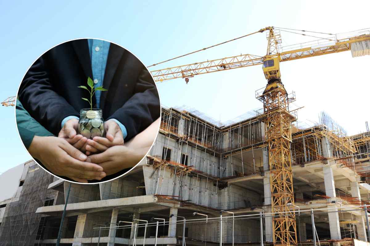 cantiere e mani insieme tengono pianta