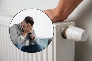uomo disperato e termosifone
