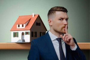 Casa e uomo fa segno di silenzio