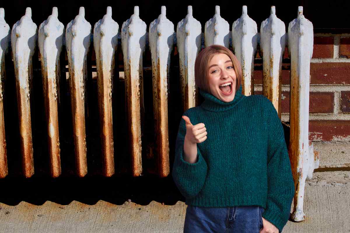 Dei termosifoni arrugginiti ed una donna ottimista in primo piano