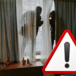 ladri che entrano in casa e simbolo attenzione