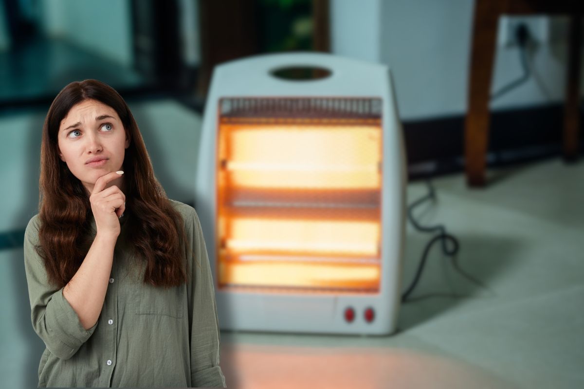 stufa elettrica accesa e donna che pensa