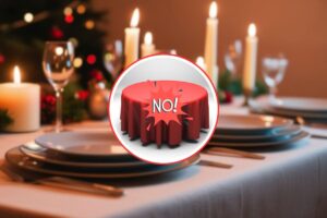 come sfondo una bella tavola imbandita per natale, in primo piano una tavola piccola con tovaglia rossa e scritto no