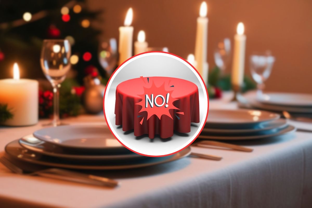 come sfondo una bella tavola imbandita per natale, in primo piano una tavola piccola con tovaglia rossa e scritto no