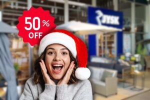 negozio di jysk visto dall'esterno, cartellino con sconto 50% e donna sorpresa