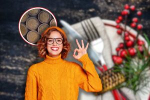 tavola natale, donna sorridente che fa ok con le mani e monete di due euro in icona