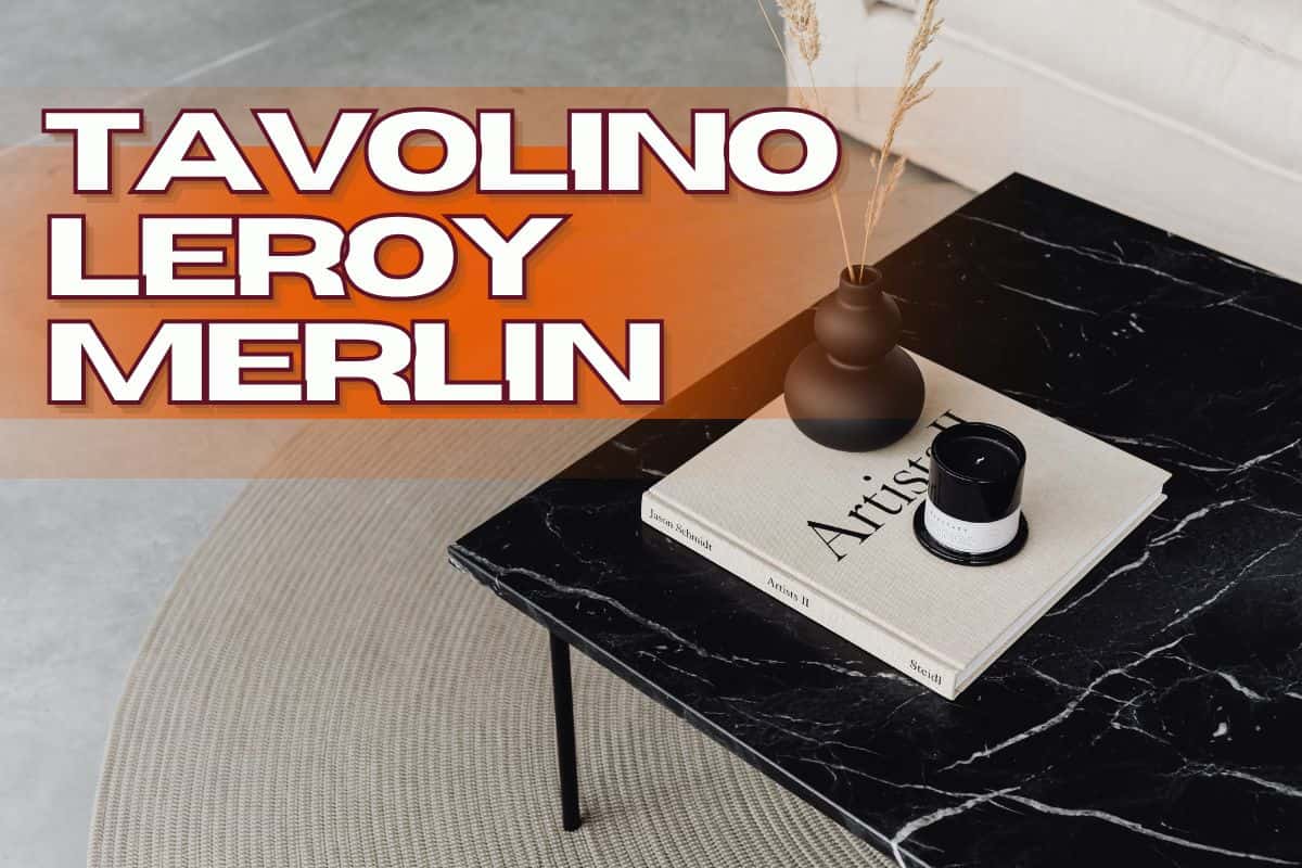 Tavolino in marmo nero con baso, candela e libro bianco