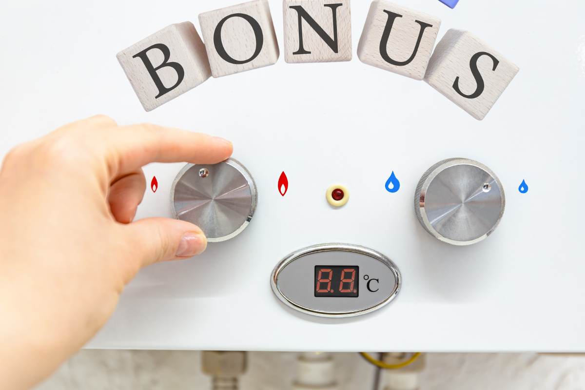 mano su caldaia con scritta bonus