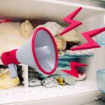 congelatore pieno e megafono con simboli rossi