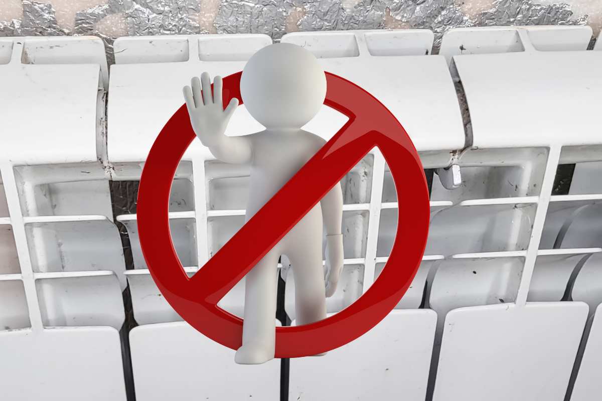 termosifone e simbolo divieto con omino e mano