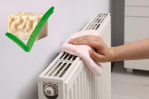 donna che pulisce calorifero e sapone di marsiglia in evidenza con spunta verde