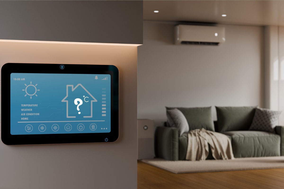 Un termostato con la temperatura impostata ed un salone con un condizionatore acceso