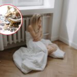 donna attaccata al termosifone e salvadanaio