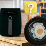 friggitrice ad aria con pentola e dentro uovo in cucina e punto interrogativo giallo