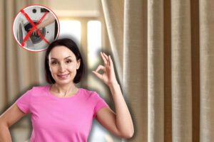 tenda beige, donna che fa ok con le mani ed x rossa su lavatrice