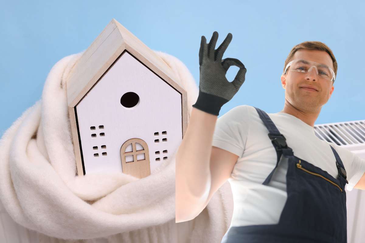 idraulico che fa segno ok con la mano e sullo sfondo casa con sciarpa