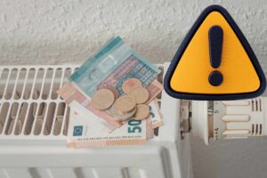 termosifone con uro sopra e simbolo di attenzione giallo