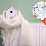modellini di casa avvolto da una sciarpa messo su un termosifone e bollette con 50% di sconto