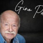 Una foto di Gino Paoli, con in alto a destra il suo nome scritto in corsivo