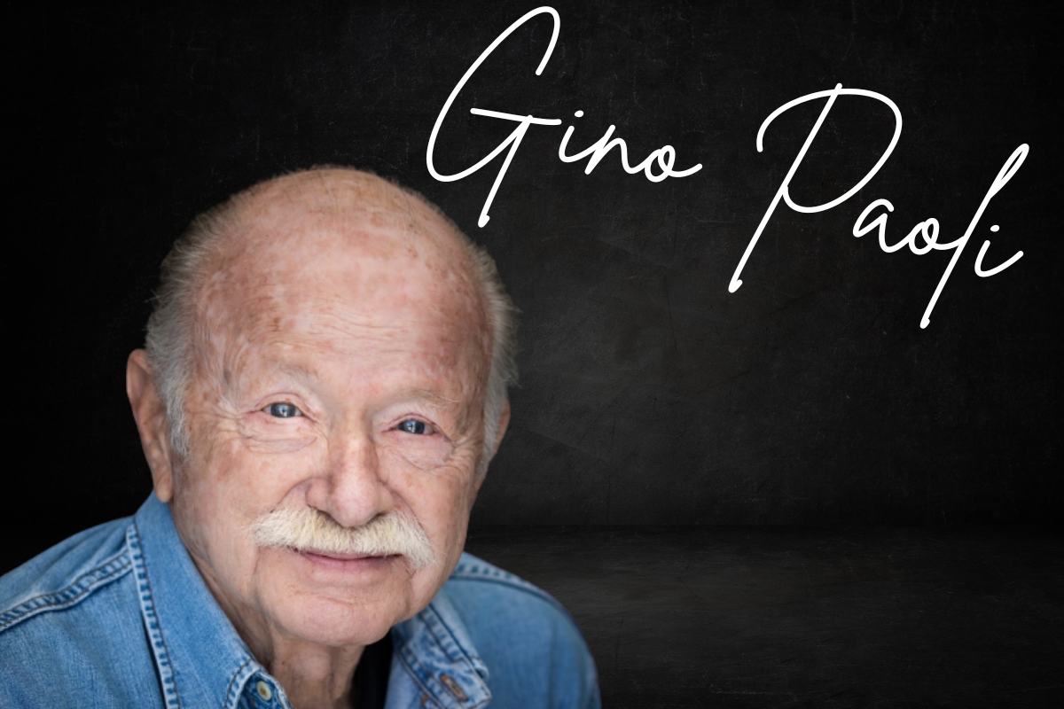 Una foto di Gino Paoli, con in alto a destra il suo nome scritto in corsivo