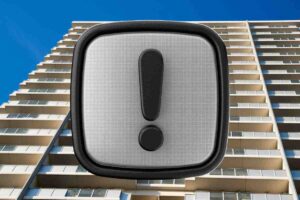 condominio e simbolo attenzione grigio