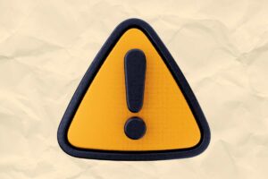 carta da forno stropicciata sullo sfondo e simbolo attenzione al centro