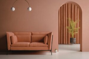 soggiorno e divano in color terracotta