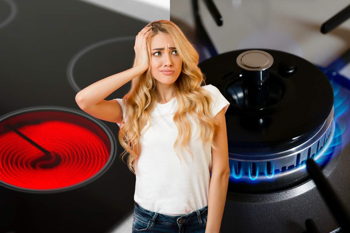 donna dubbiosa con dietro piano ad induzione e fornello a gas