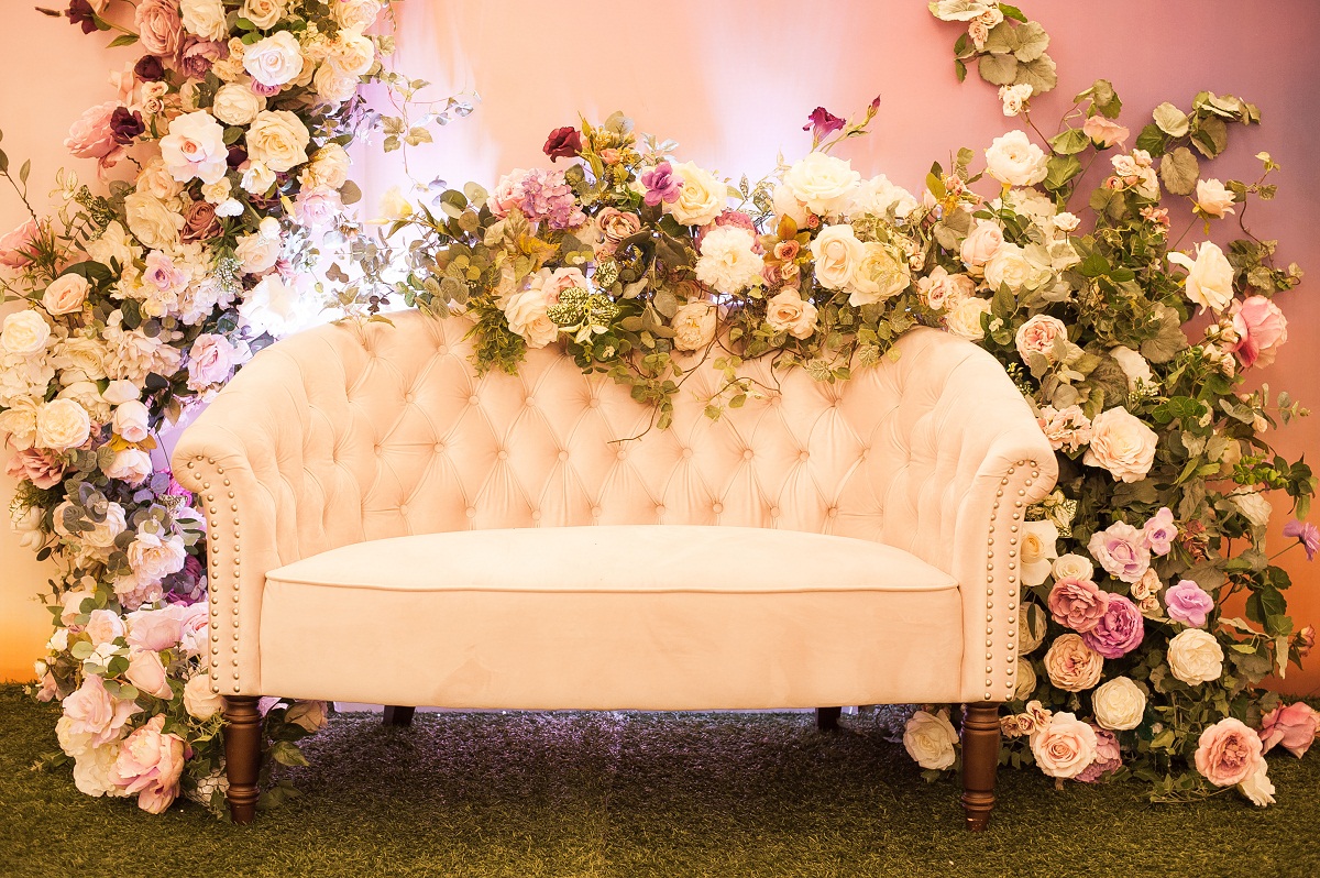 Photozone,Light,Sofa,Decorated,With,Artificial,Flowers,Of,Roses,On
